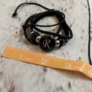 Brand new adjustable braided strappy black R bracelet